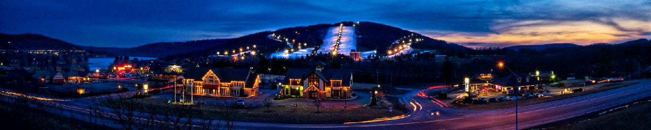 Winter evening view of Wisp Resort facilities and ski runs.