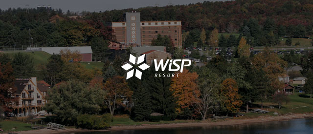 Wisp Resort logo over the Wisp Resort buildings faded out.